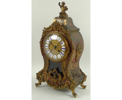 A French 19th century boulle and tortoiseshell mantel clock, with eight day striking movement by Japy Freres, the gilt brass 