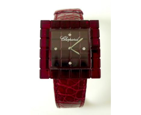 A lady's Chopard resin square set 'BE MAD' watch, number 12/7780, 4000/9999, 'Swiss Made', complete with red strap with stain