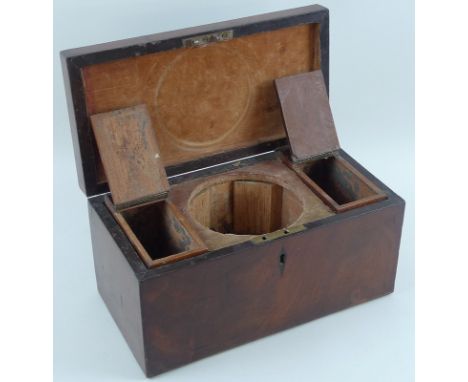 A Georgian mahogany tea caddy, stringing to lid, kite form escutcheon, fitted interior, the two hinged caddies flanking space