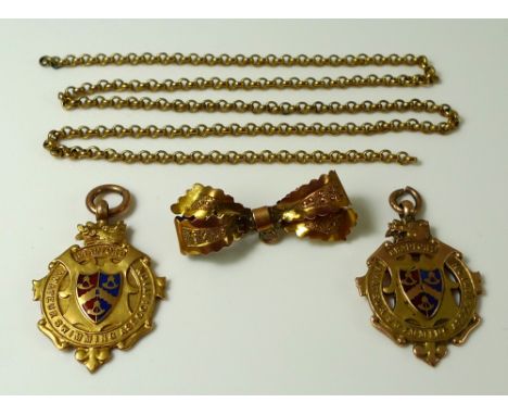 A pair of 9ct gold and enamel medals from the Amateur Swimming Association, Bradford, inscribed to the backs, together with a