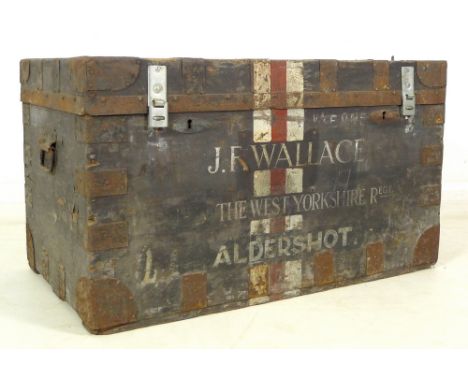 A pine and iron bound travelling trunk, J. R. Wallace, West Yorkshire Regiment, Aldershot, 91 by 52.5 by 53cm high.