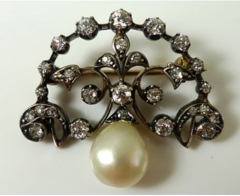 A late Victorian diamond and pearl brooch, the scrolling yellow metal body set with diamonds with a Baroque pearl suspended b