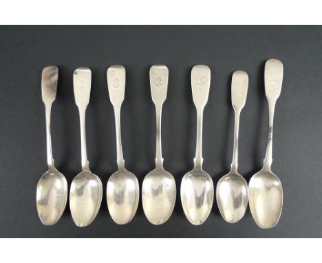 A group of silver Victorian spoons, comprising a set of four fiddle pattern rat tail tea spoons, the terminals engraved with 