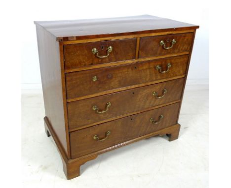A Georgian walnut veneered chest of drawers with three long under two short drawers, raised on bracket feet, 93.5 by 55.5 by 