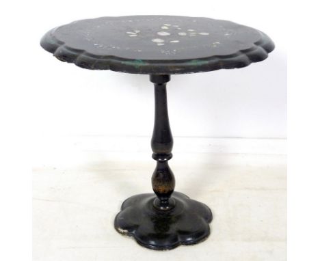 A Victorian papier mache occasional table, ebonised with mother of pearl inlay and gilt decoration, lobed oval tilt top surfa