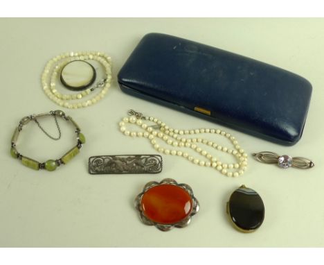 A collection of vintage silver and costume jewellery, comprising various silver and hardstone brooches and pendants, a silver