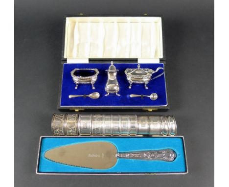 A silver cruet set, the salts with blue glass liners, napkin rings and a sterling handled cake slice, 9toz weighable silver, 