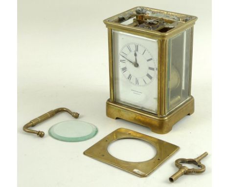 An R&C, Paris, late 19th century brass carriage clock, retailed by Spiridion & Son, Cardiff, complete with key, a/f top detac