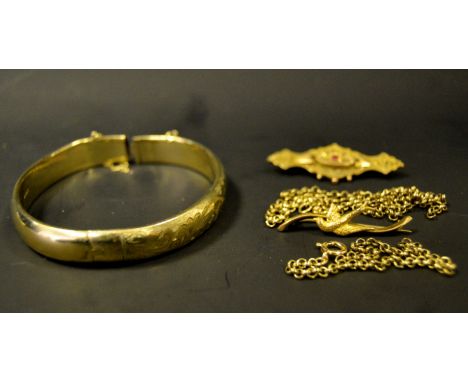 A 9ct gold chain;  a gold plated hinged bangle;  a 9ct gold bird brooch;  etc 