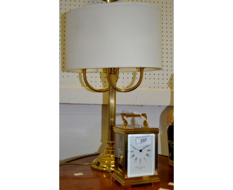A Taylor and Bligh, London brass carriage clock repeater; a brass table lamp (2)