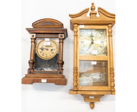 Two clocks. (1) A Continental Mantel Clock in stained wooden case, plus pendulum. 2 train movement. Striking on a gong.(2) A 