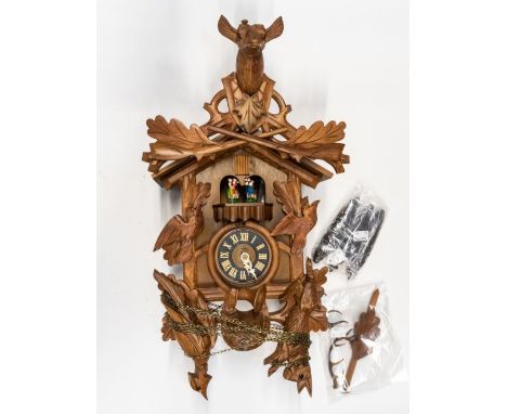 Cuckoo clock. Three train and two bellows. A modern Black Forest-style clock with cuckoo and Austrian dancers on chimes. Case