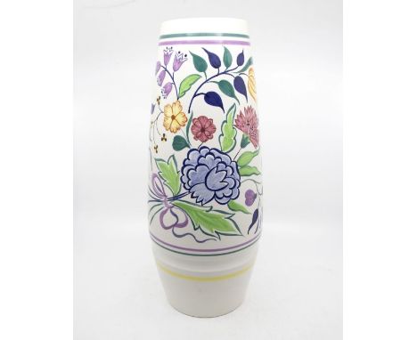 Poole Pottery: A Poole Pottery floral pattern vase on white ground, shape mark 85. Height approx 40cm. Marks to the base.