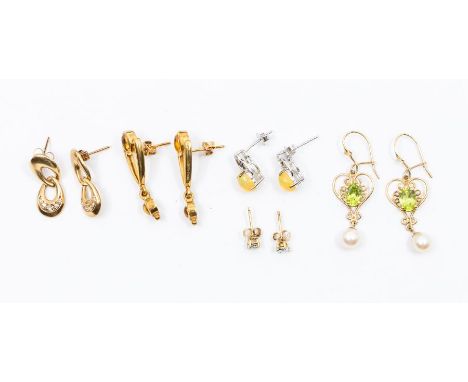 A collection of 9ct gold and gem set earrings to include a pair of citrine drop earrings, peridot and pearl drop earrings, al