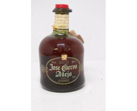 A Bottle Of Jose Cuervo Anejo Tequila Bottle Is In Good Overall Condition And Is Still Sealed And Measures Into Neck. 