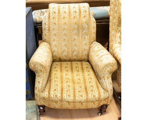 A Victorian sofa chair having turned legs on casters with gold upholstery