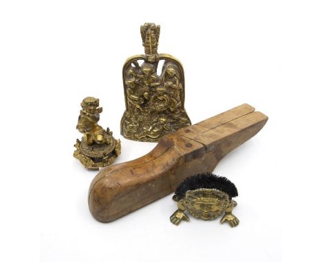 A brass nib cleaner and together with another brass item and a giult metal cherub, with a wooden shoe last.