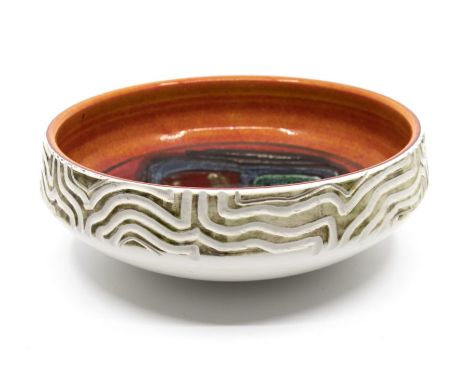 Poole Pottery: A Poole Pottery Delphis bowl with carved decoration to the exterior, shape mark 89. Diameter approx 28cm. Mark