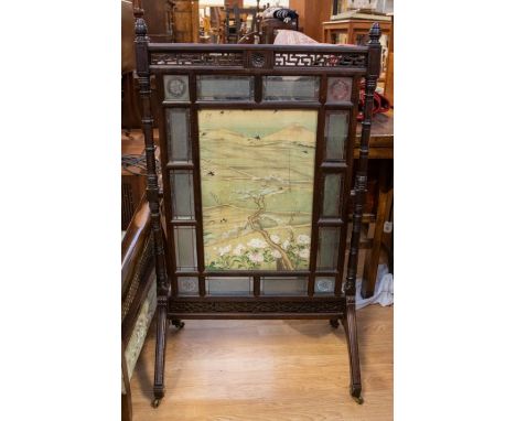 A&nbsp; late 19th Century fire screen, stained glass and watercolour on silk panels, on casters