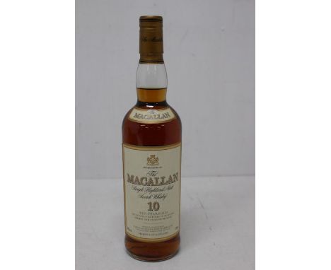 A Bottle Of The Macallan 10 Year Old Single Malt Scotch Whisky The Bottle Is Still Sealed And Measures Into The Neck. 