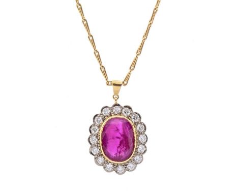 A ruby and diamond 18ct gold oval cluster pendant, comprising a central rub over set oval ruby approx 10 x 12mm, stone facet 