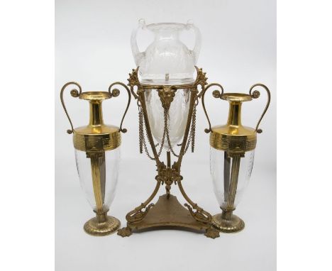 A Victorian gilt metal and etched glass vase, the twin-handled waisted vase, etched with foliage, the tripod stand applied wi