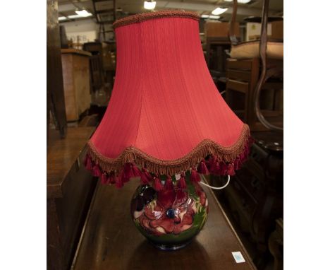 Green ground Moorcroft table lamp with shade, 25cm height, Moorcroft lamp only