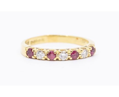 A ruby and diamond 18ct gold half eternity ring set with alternate round cut rubies and diamonds, size M1/2, total gross weig