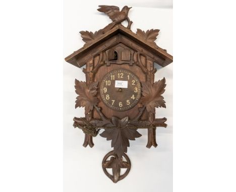 A good Black Forest Cuckoo Clock with two cuckoo birds, 5 inch Arabic numeral dial (no hands) contained in a dark stained cas