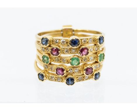 A gem set 18ct gold multi row ring, comprising five rows, alternately set with three and two coloured gem stones including sa