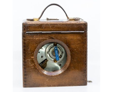 Pigeon timing clock in oak case, serial number 45589 contained in chrome case