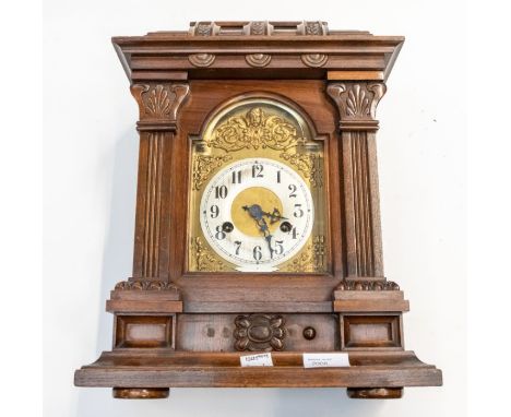 An Edwardian Mantel Clock retailed by " W. Greenwood" (label on rear door). 8-day Junghans movement chiming a gong. Contained