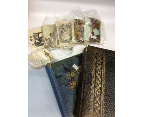 A collection of vintage postcards and 2 empty vintage albums.