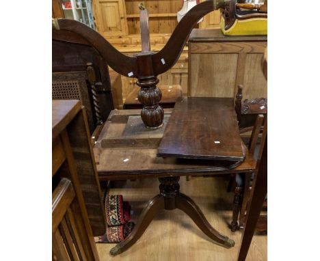 A reproduction Georgian style dining table on tripod legs (one broken and glued) along with four early 20th Century mahogany 