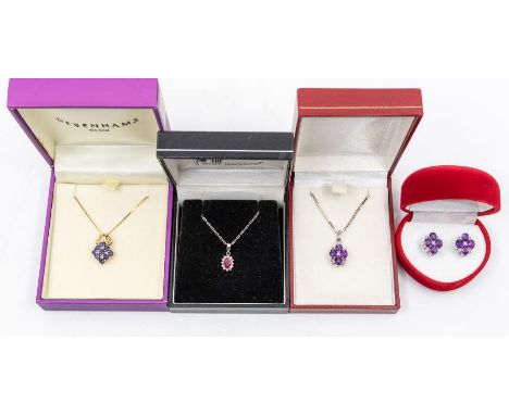 A ruby and diamond 9ct white gold cluster pendant set with a oval cut ruby within a diamond set border, diameter approx. 6 x 