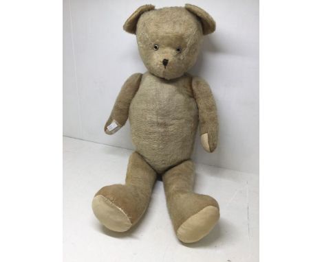 A large vintage jointed teddy bear with padded paws, measuring approx 95cms