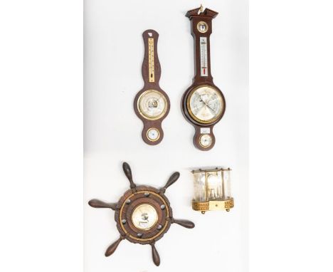 (1) Barometer by Cornitti of London.(2) Small ship's wheel barometer(3) Small banjo-style barometer(4) Small manual wind cloc