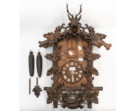 Large late Victorian cuckoo / trumpeter- style clock with carved deer's head pediment with carved dogs and leaf to case. Many