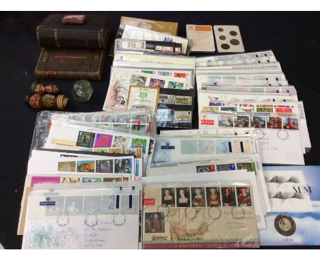 a collection of first day cover stamps, coins, vintage bibles, old bottle stoppers.&nbsp;