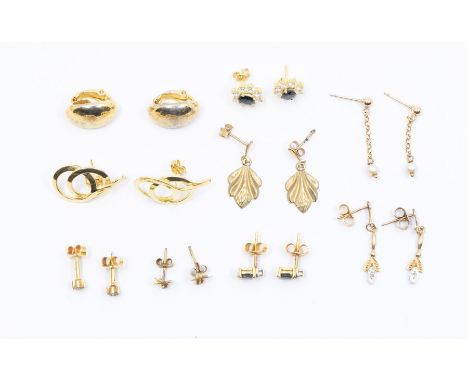 A collection of earrings to include diamond and sapphire studs, pearl drop earrings, three colour gold diamond set drops, rub