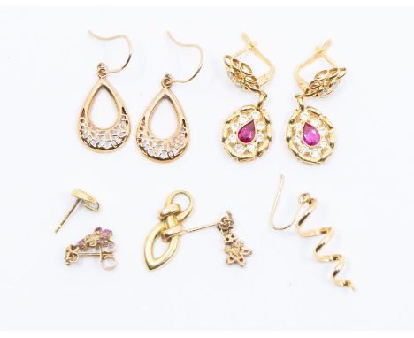 A pair of 18ct gold earrings set with red and white stones, total gross weight approx 3gms a pair of 9ct gold ruby set drop e