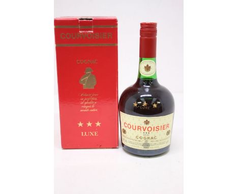 A Bottle Of Courvoisier 3 Star Luxe Cognac In 1980s Bottling With Original Box. Bottle Is Still Sealed And Measures Into Neck