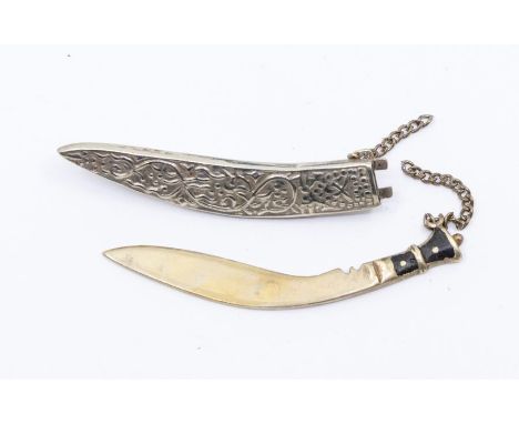 A white metal scabbard and dagger brooch,  embossed decoration, size approx 65mm, in fitted case Condition report: marks and 