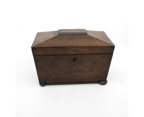 A 19th Century mahogany tea caddy on bun feet