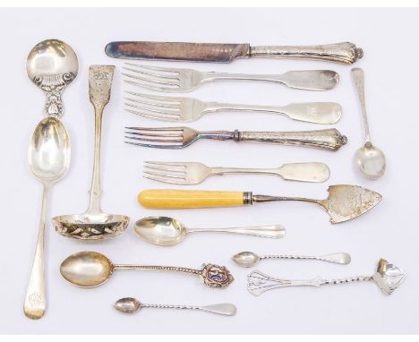 A group of silver flatware to include: George III spade shaped cheese (stilton) server / scoop, engraved with a crest, bone h