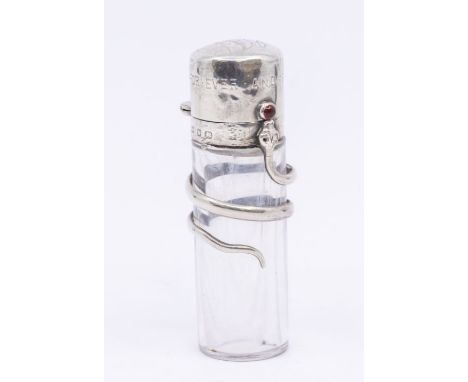 A Victorian novelty silver mounted plain glass scent bottle, the body entwined with a silver snake, the head with ruby colour