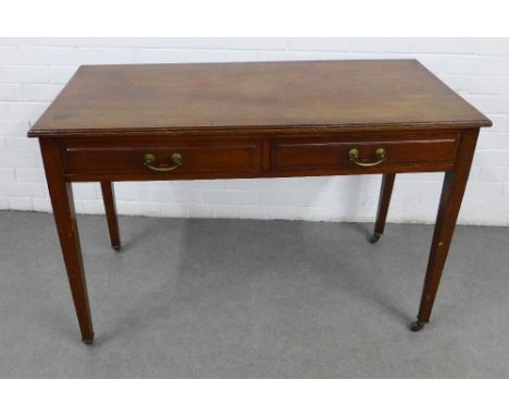 Mahogany writing desk / table with two frieze drawers, raised on square tapering legs, with brass caps and ceramic castors, 1