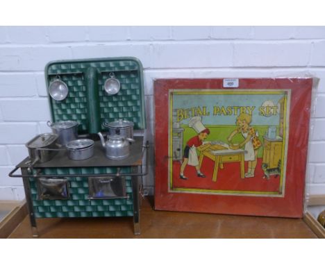 Early 20th century tin plate stove with accessories and a vintage boxed Betal Pastry Set (2) 