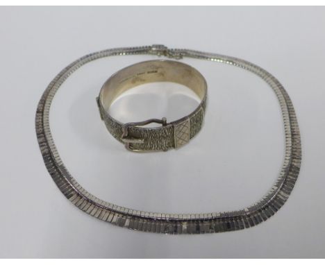 Vintage silver bracelet with textured finish and buckle clasp, hallmarks for Birmingham 1970 and a Sterling silver necklace w