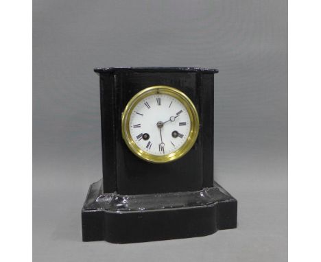 Mantle clock with a French brass movement striking on a gong, housed in a painted black case, 22cm